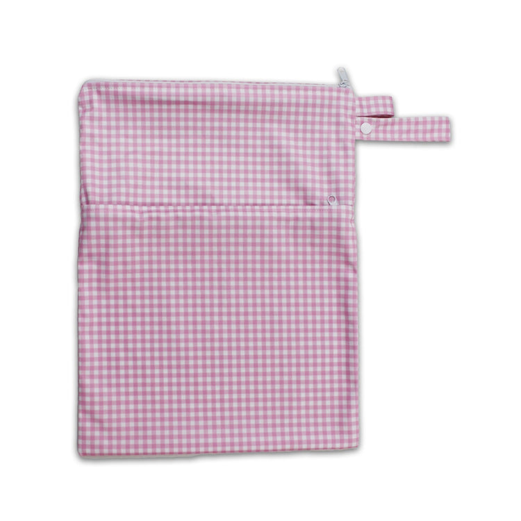 Waterproof baby travel wet bag in pink check print, featuring a secure zipper and snap pram loop.