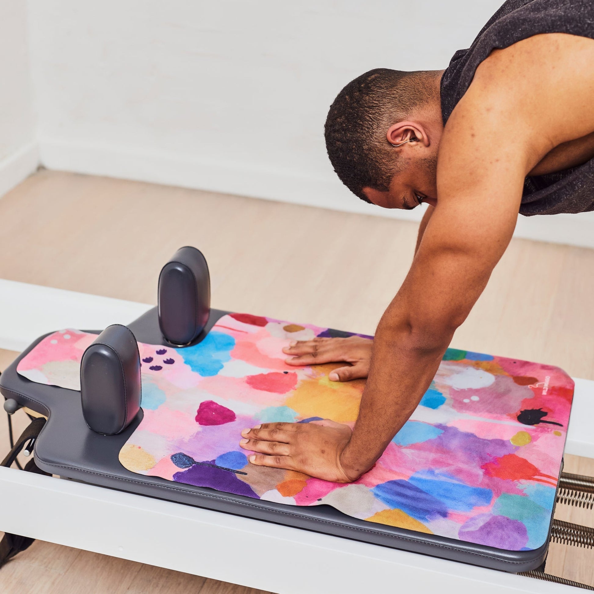 Wild Mingo artistic printed reformer mat fitted perfectly onto a professional studio Pilates reformer machine.