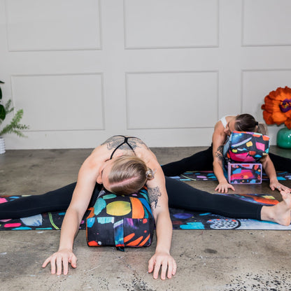 Wild Mingo printed eco yoga bolster used for back alignment and support during an at home yin yoga or meditation routine.