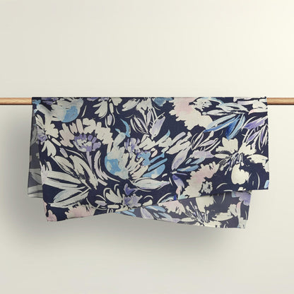 The Wildflowers floral fabric wrap draped over a wooden rod to show the premium deadstock material texture.