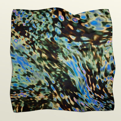 Unfolded digital puddle fabric wrap by Wrap Revolution, showcasing the upcycled European fashion house deadstock material.