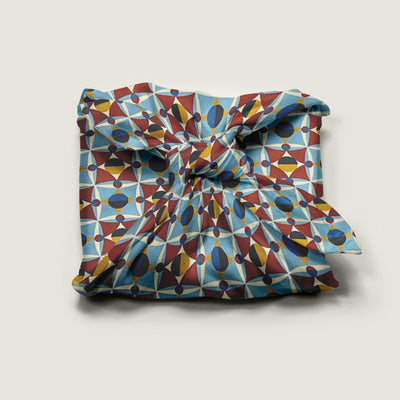 Wrap Revolution Shapeshifter fabric gift wrap tied around a gift box. Sustainable furoshiki wrap in Australia.