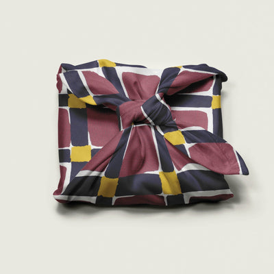 Wrap Revolution Unchained fabric gift wrap tied around a gift box. Sustainable furoshiki wrap in Australia.