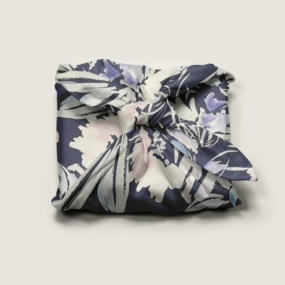 Wrap Revolution Wildflowers fabric gift wrap tied around a gift box. Sustainable furoshiki wrap in Australia.