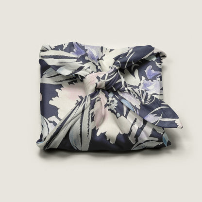 Wrap Revolution Wildflowers fabric gift wrap tied around a gift box. Sustainable furoshiki wrap in Australia.