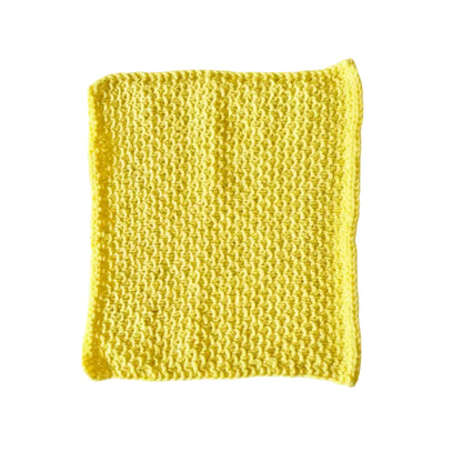 Yellow handmade knitted dishcloth made from absorbent recycled cotton for kitchen and bathroom use.