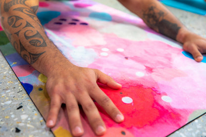 Man's hands on Wild Mingo Yoga Mat Joy in a yoga studio