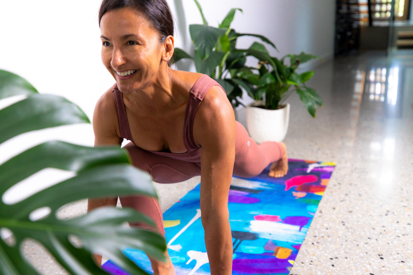 Yoga Mat | Wild Mingo |  Swell Recycled Rubber & Microsuede Non-Slip being used by a woman in a studio long shot