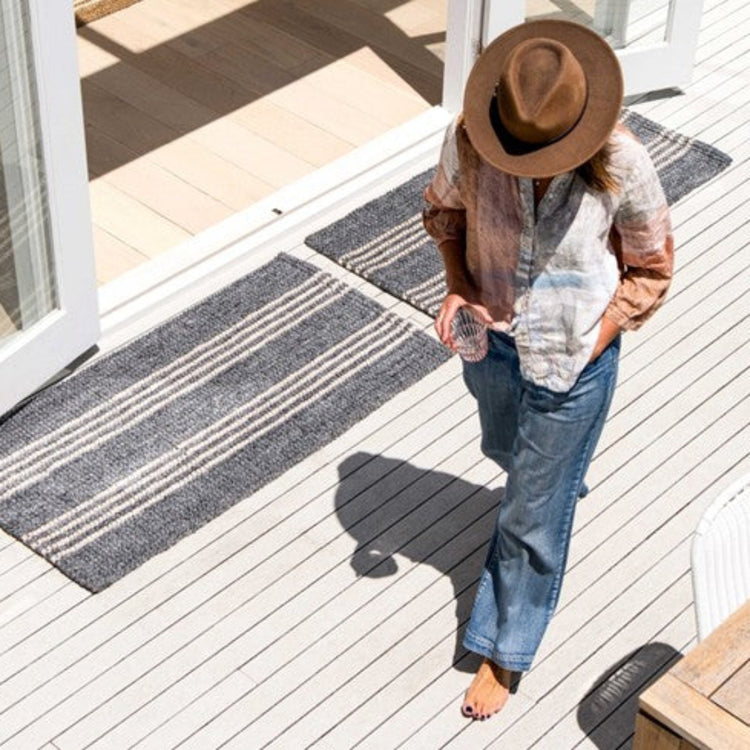 Zebra Home Cornell Lite grey striped indoor outdoor runner and doormat styled on a modern timber deck.